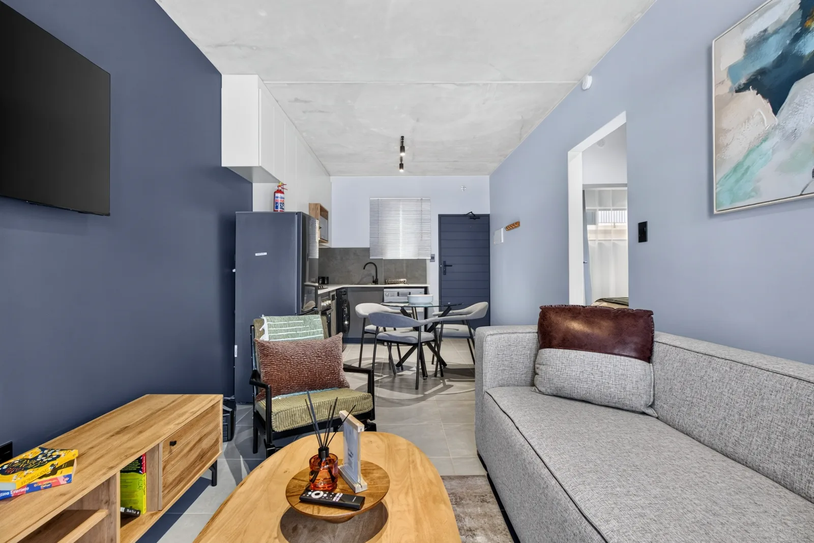 Living area with wall-mounted smart television